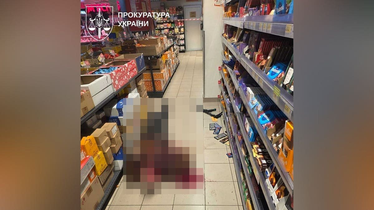 The gunman was pictured dead in the convenience store.