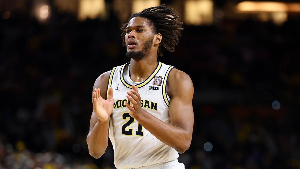 Morez Johnson Jr. celebrating after scoring a basket.