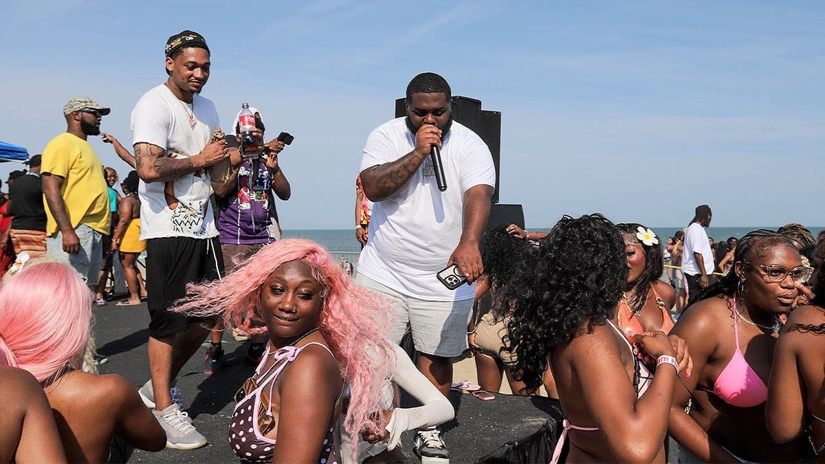 Performers interact with dancers