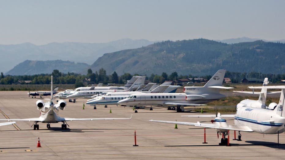 Private jets sit parked at the Jackson Hole airport in Jackson, Wyoming
