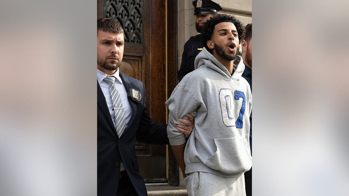 Asil Assaidi is pictured leaving the NYPD's 104th Precinct stationhouse in Queens on Thursday, April 23, 2026.