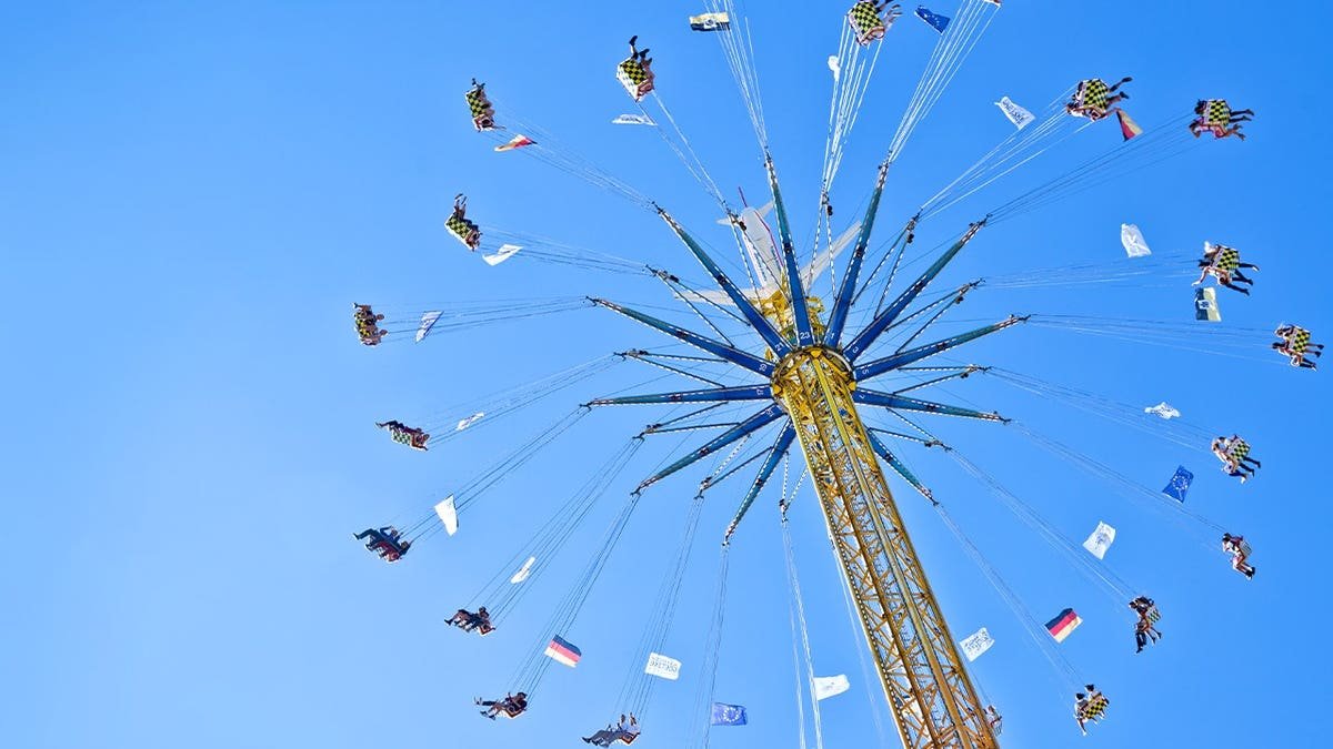 Stock image of chair swing ride at amusement park