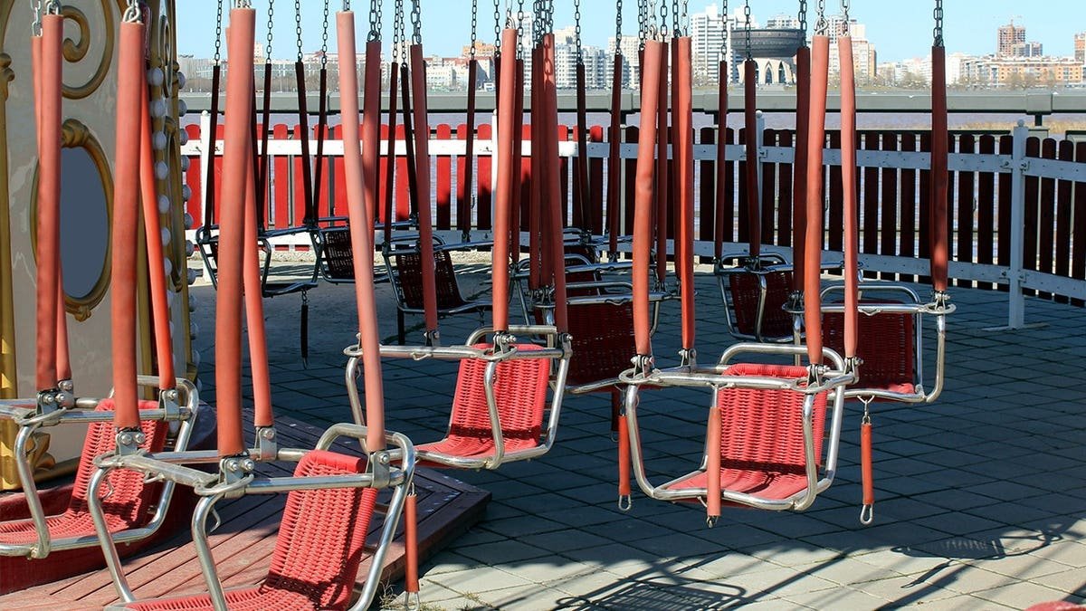 Stock image of empty chair swing ride