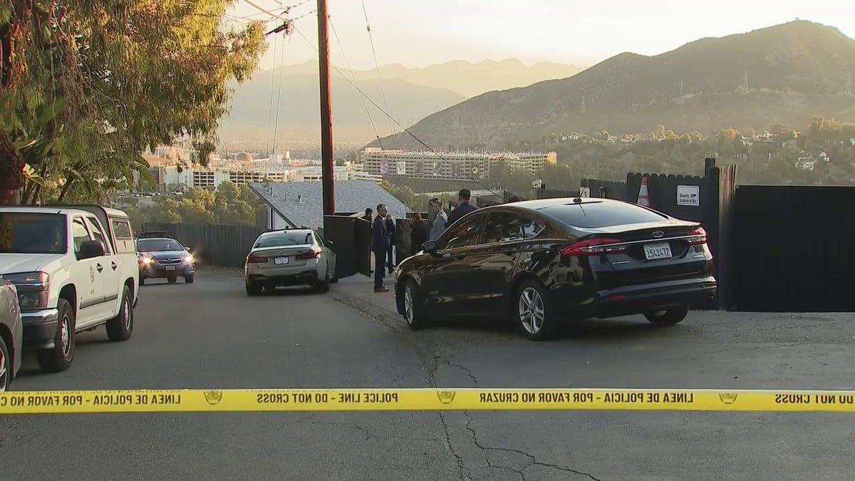 LAPD officers investigating armed robbery scene in Hollywood Hills home