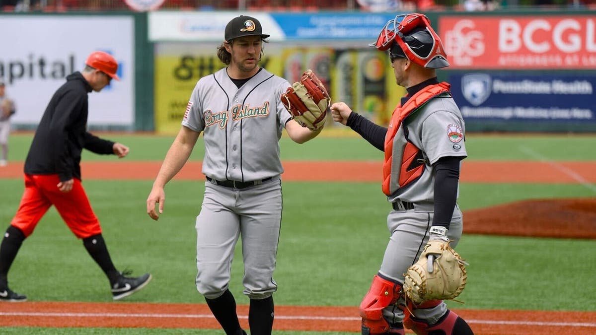 Trevor Bauer and catcher acknowledge each other