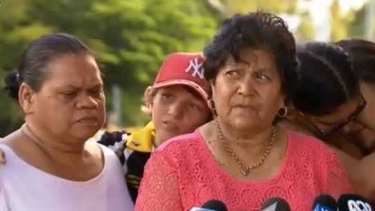 Advocate for Aboriginal and Torres Strait Islander rights and the family's spokeswoman Gracelyn Smallwood with some family members and elders mourning the death of two boys who died in a far north Queensland river.