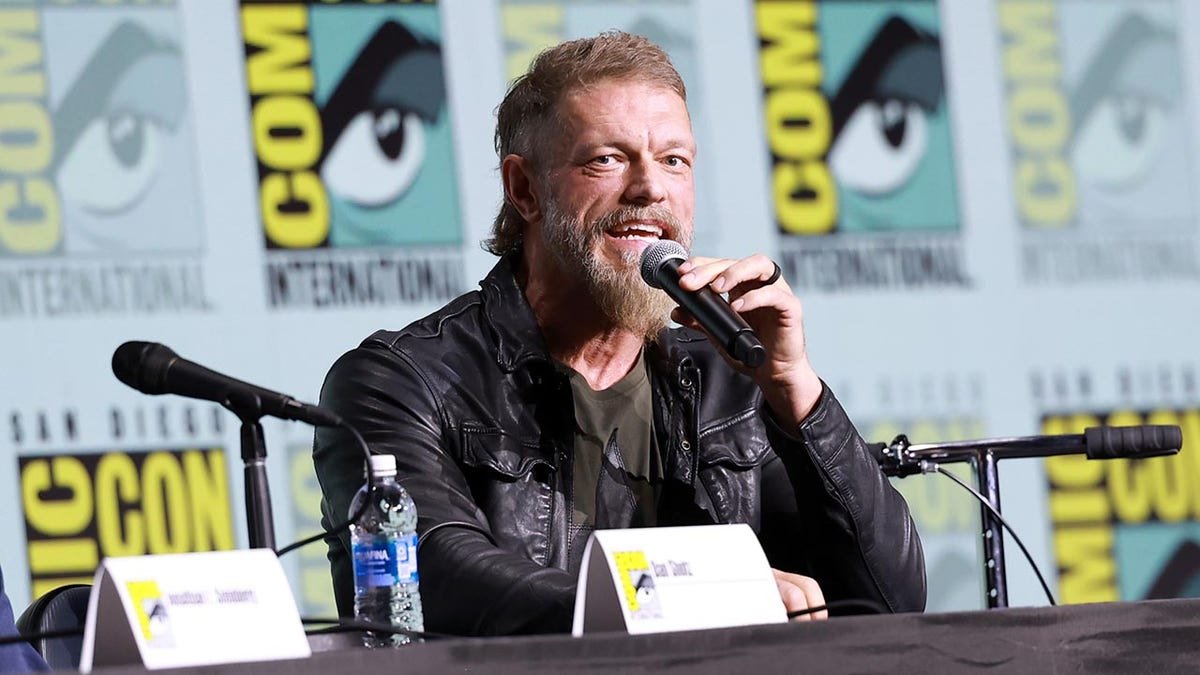 Adam Copeland speaking onstage at the Percy Jackson and the Olympians panel