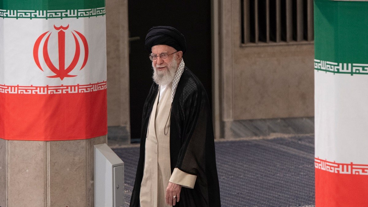 Ayatollah Ali Khamenei arriving to cast his vote during the 2024 presidential election