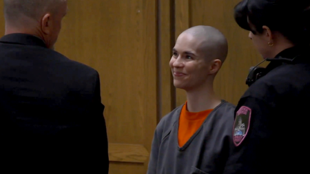 Bald-headed killer smiles as prosecutors reveal what she did before dad walked in Bald-headed killer smiles as prosecutors reveal what she did before dad walked in