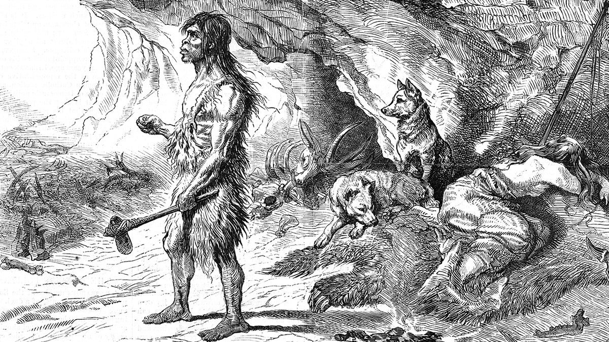 Ancient caveman with dogs