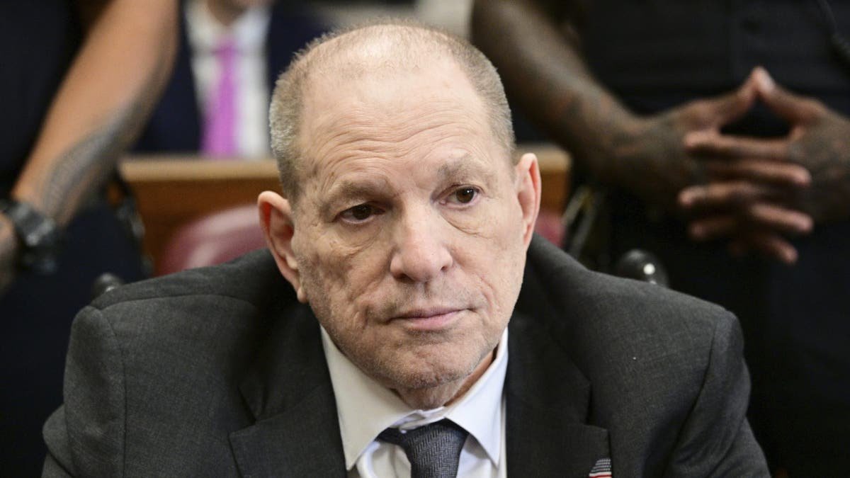 Harvey Weinstein standing in a Manhattan state court courtroom.