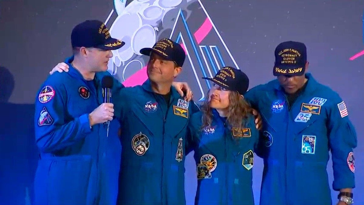 Artemis II crew on stage at welcome home ceremony