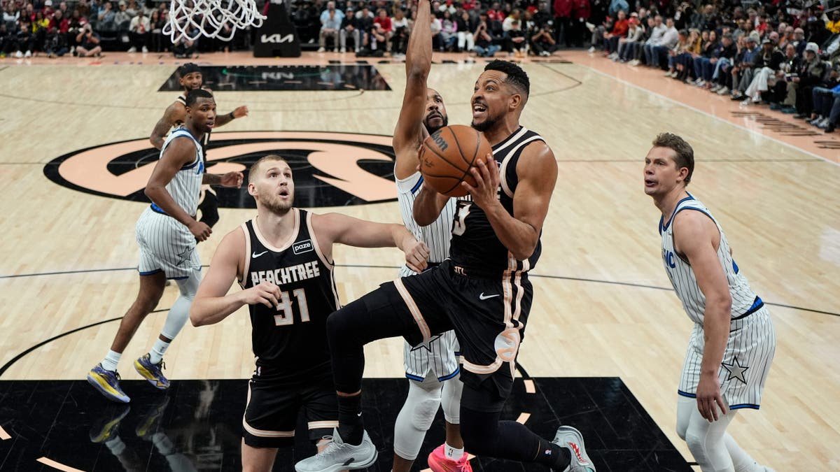 Atlanta Hawks guard CJ McCollum shooting basketball against Orlando Magic