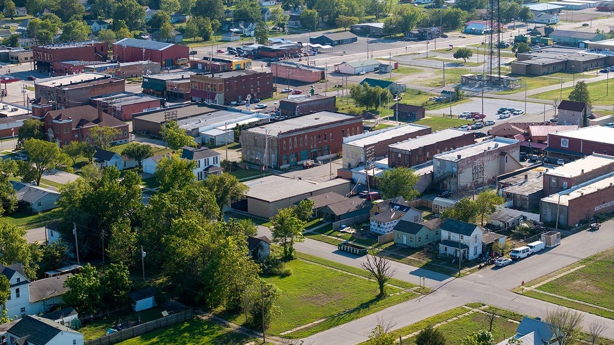 Aerial view of Baxter Springs Kansas main street with red brick buildings and clear sky