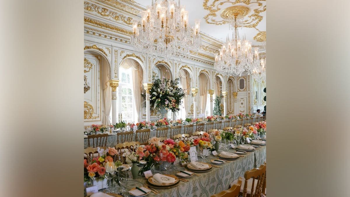 Elegant bridal shower table setup in a grand ballroom with crystal chandeliers for Bettina Anderson.