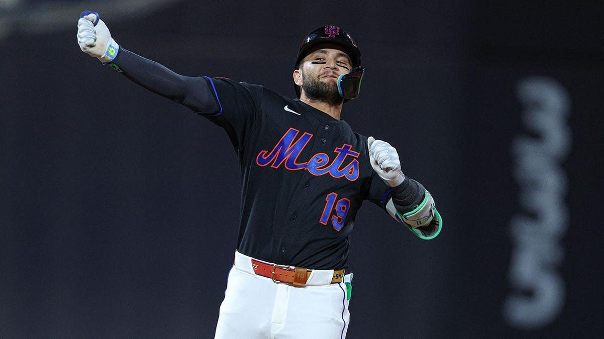 New York Mets shortstop Bo Bichette celebrating after hitting a three-run double at Citi Field