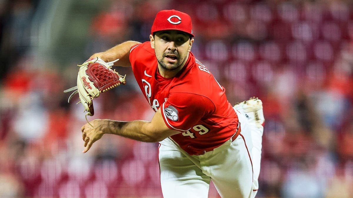 Cincinnati Reds relief pitcher Brock Burke pitching during a baseball game