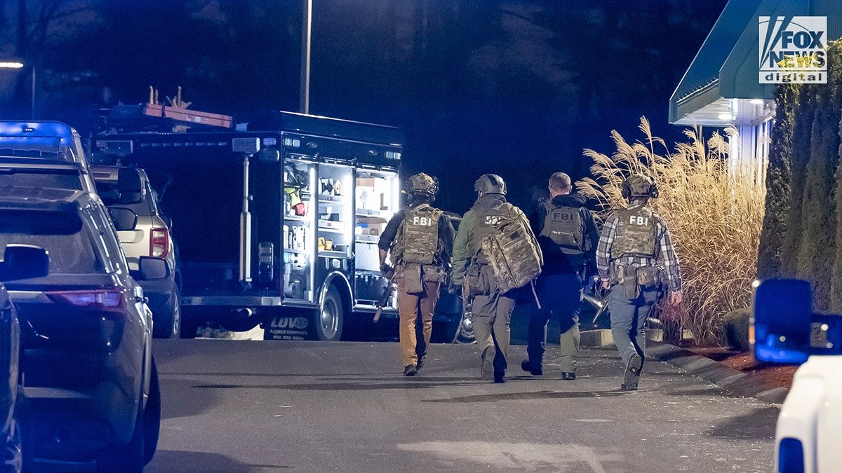 Investigators collecting evidence at the scene where Claudio Manuel Neves-Valente was found dead in Salem, N.H.