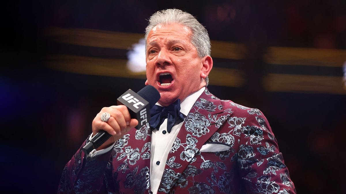 UFC ring announcer Bruce Buffer standing in the octagon at T-Mobile Arena