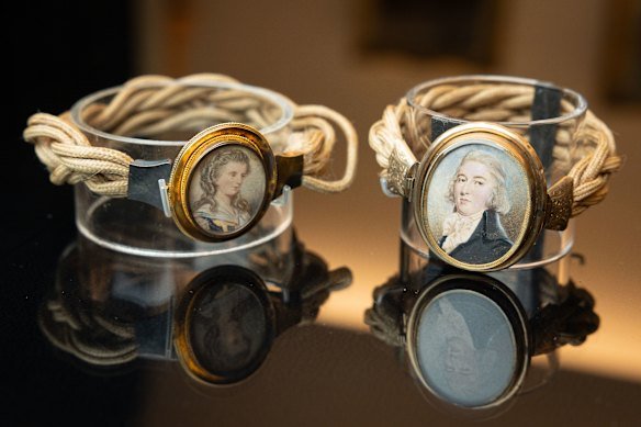 Portraits of colonial landowner John Blaxland and his wife Harriott are attached with ropes of their plaited hair. 
Hairwork jewellery like this was treated as family heirlooms.
