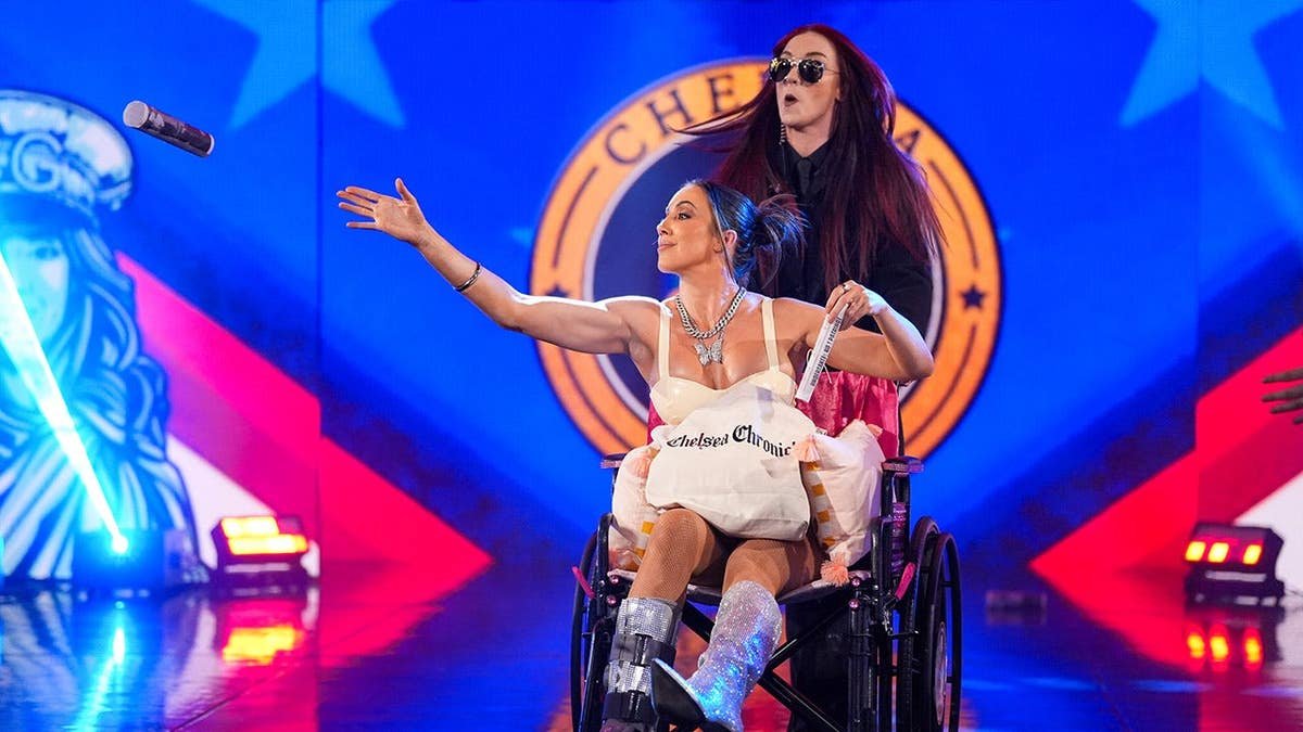 Chelsea Green and Alba Fyre entering the wrestling ring at KFC YUM! Center