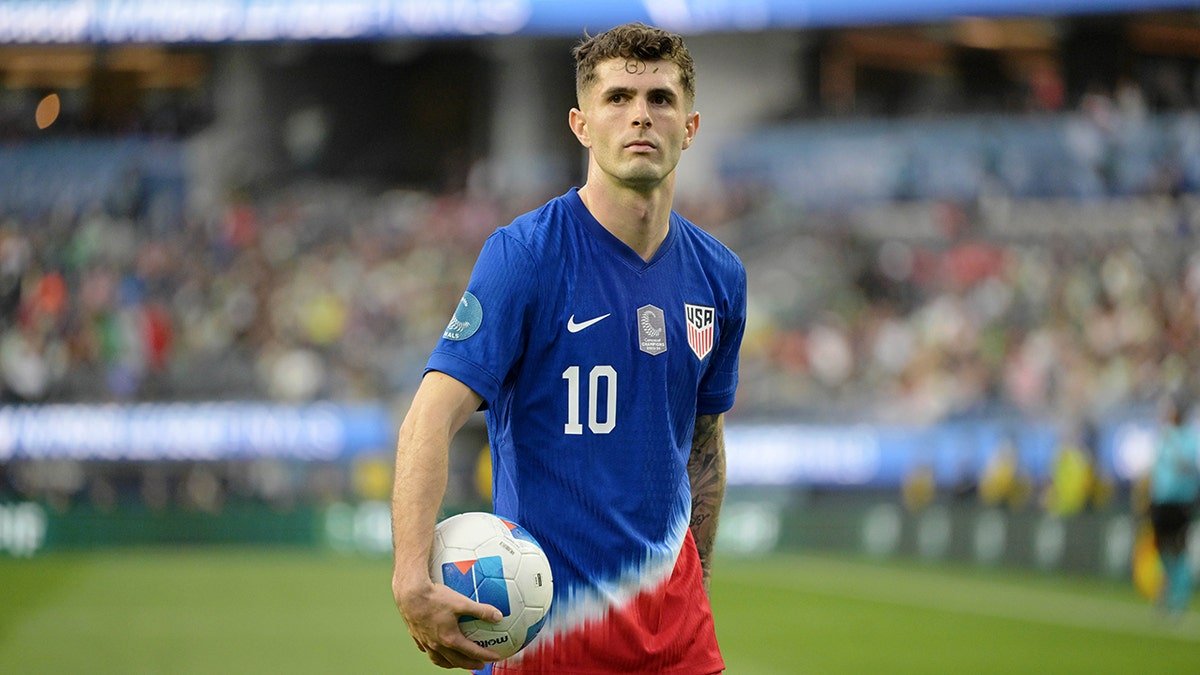 United States forward Christian Pulisic reacting on the field during a soccer match