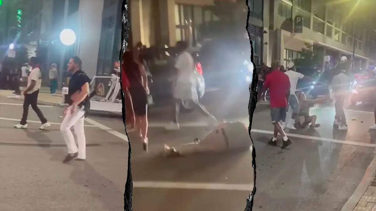 Individuals involved in a street brawl in Cincinnati yelling and fighting