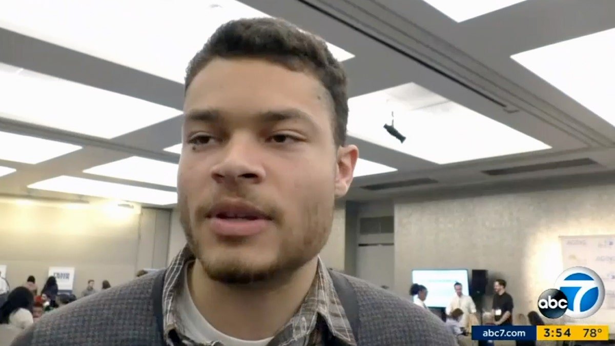 Cole Allen talks to a news crew.