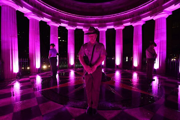 Members of the catafalque party stand guard at the cenotaph during an Anzac Day dawn ceremony.