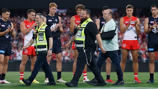 First responders of the Bondi terror attack and Ahmed Al Ahmed, the hero who wrestled a gun from one of the shooters, are acknowledged during the 2026 AFL Opening Round match between the Sydney Swans and the Carlton Blues at the Sydney Cricket Ground on Thursday.