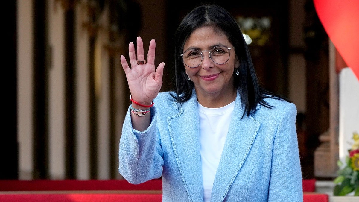 Venezuela's acting President Delcy Rodriguez waving at Miraflores Palace in Caracas