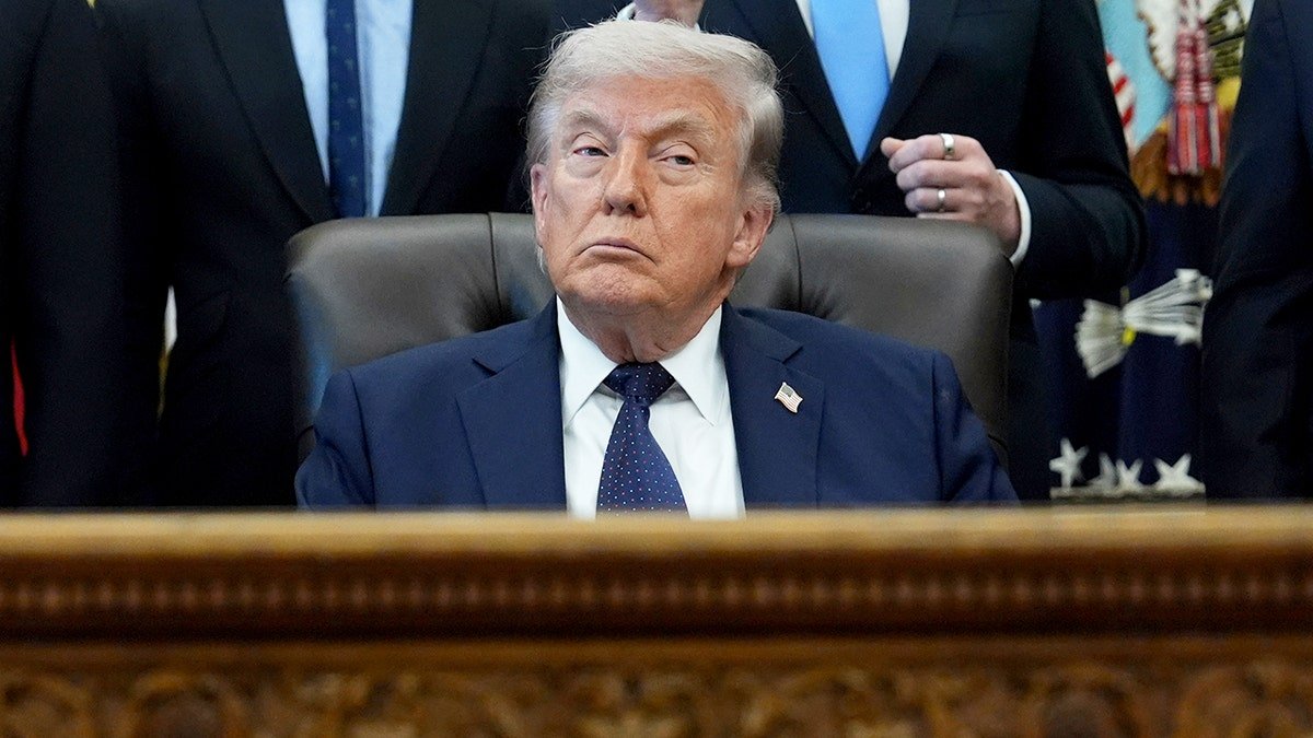President Donald Trump standing in the Oval Office at the White House