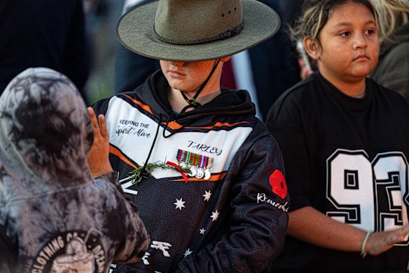 Young and old commemorate Anzac Day.