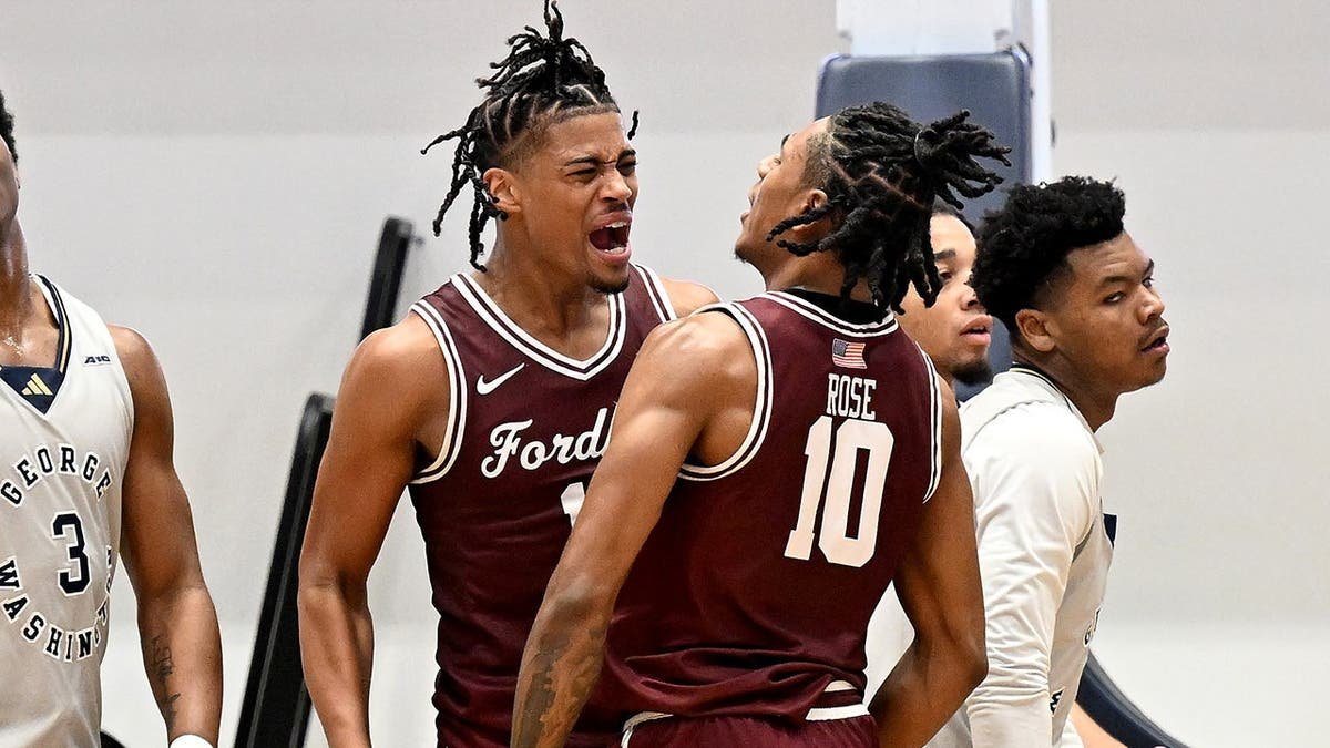 Elijah Gray and Kyle Rose celebrating during a basketball game at Charles E. Smith Athletic Center