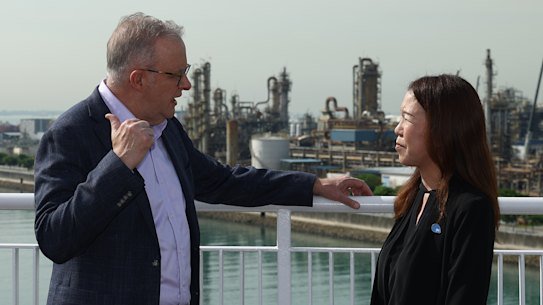 Anthony Albanese is shown an overview of Jurong Island operations by JTC Corp assistant chief Christine Wong. The prime minister continues his petrol diplomacy to Brunei on Tuesday.