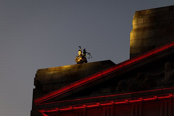 A lone bagpiper welcomed the dawn from the roof of the Shrine. 