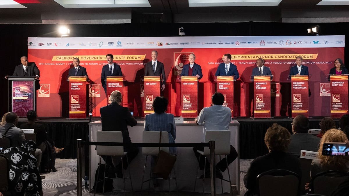 several candidates seen at a panel during a forum