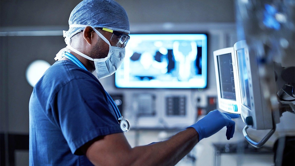 Surgeon looking at a monitor in an operating room