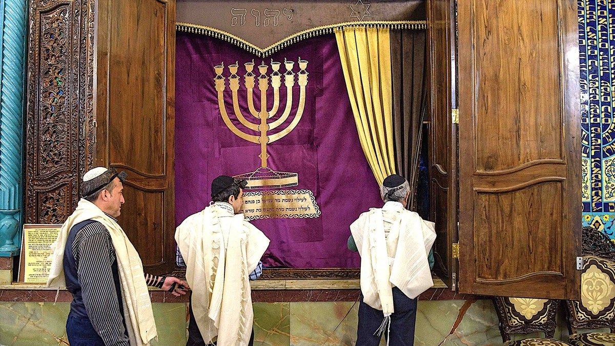 Men in synagogue in Tehran, Iran.