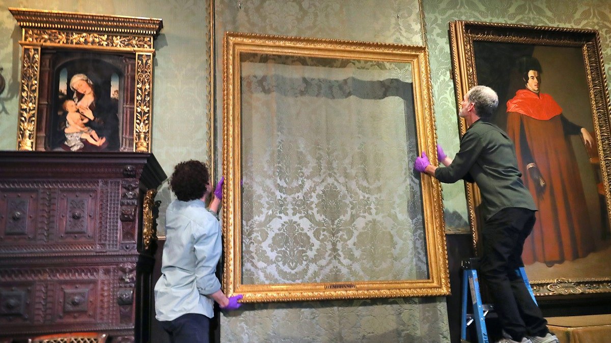 Isabella Stewart Gardner museum conservators restoring empty frames inside the museum