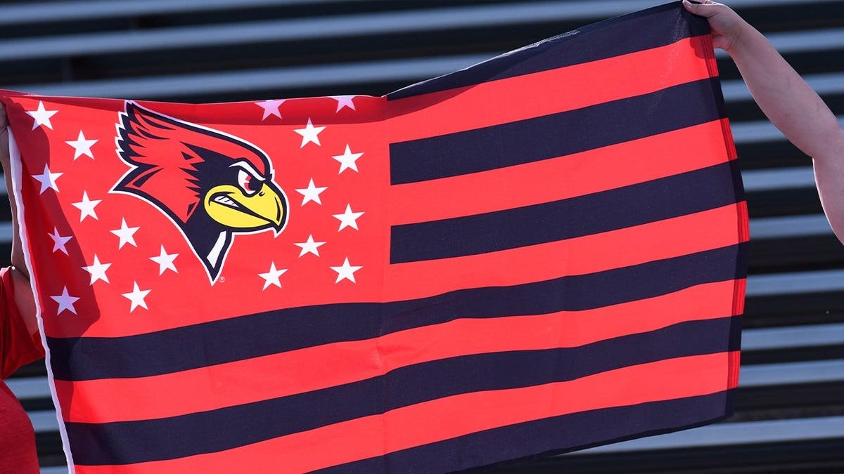 red and black striped flag with bird image on left corner