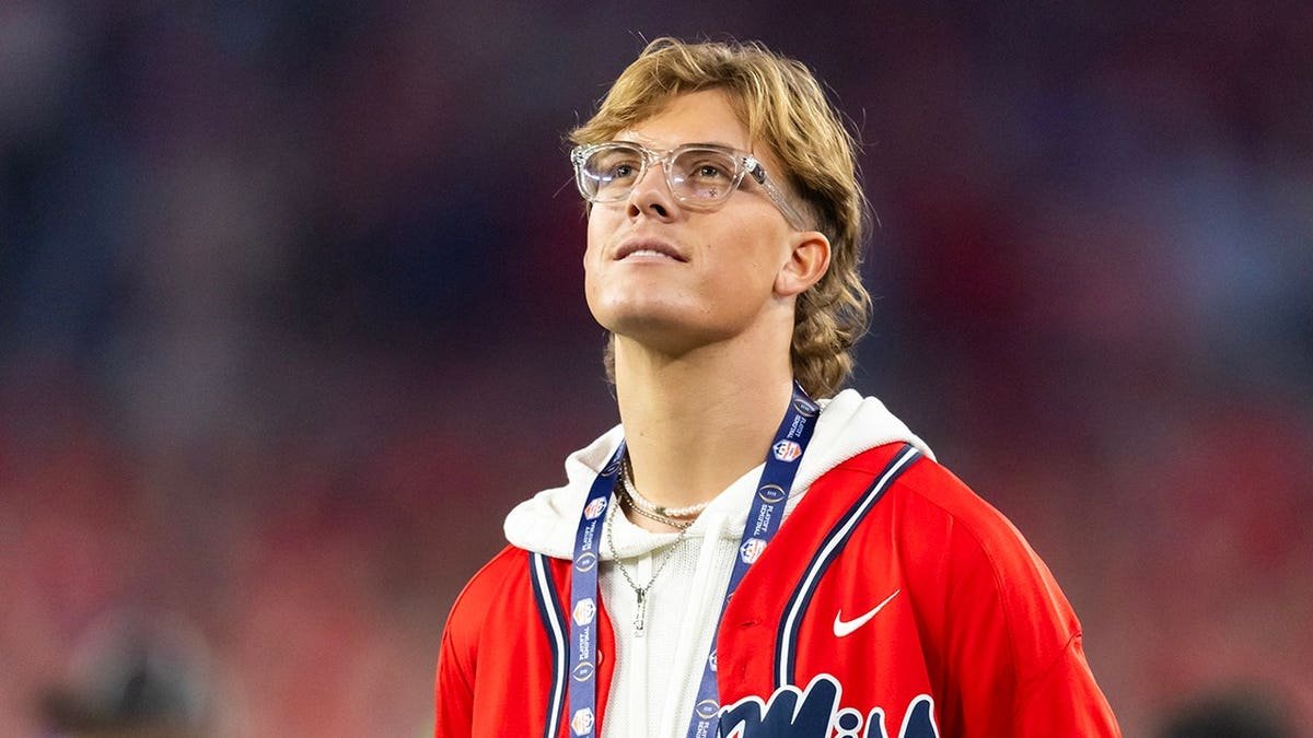 Mississippi Rebels former quarterback Jaxson Dart standing at State Farm Stadium.