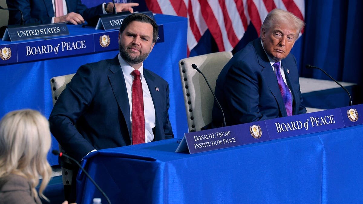 U.S. Vice President JD Vance and President Donald Trump standing together at the Donald J. Trump Institute of Peace.