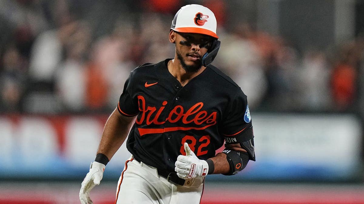 Baltimore Orioles' Jeremiah Jackson rounding bases after hitting home run.