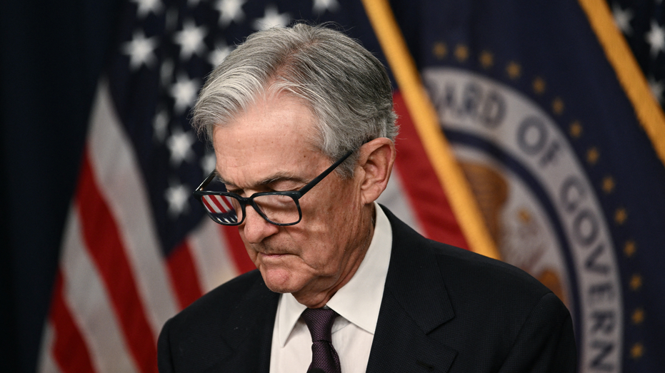 U.S. Federal Reserve Board Chairman Jerome Powell looks at his notes during a Federal Open Market Committee meeting