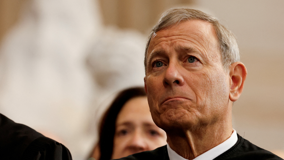 U.S. Supreme Court Chief Justice John Roberts standing in the U.S. Capitol Rotunda