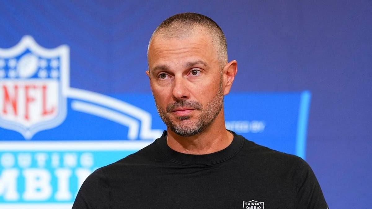 John Spytek speaking at a press conference at the NFL Scouting Combine in Indianapolis