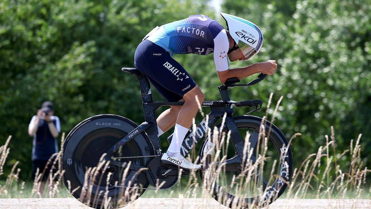 Kiaan Watts cycling during an individual time trial in Ham, Belgium