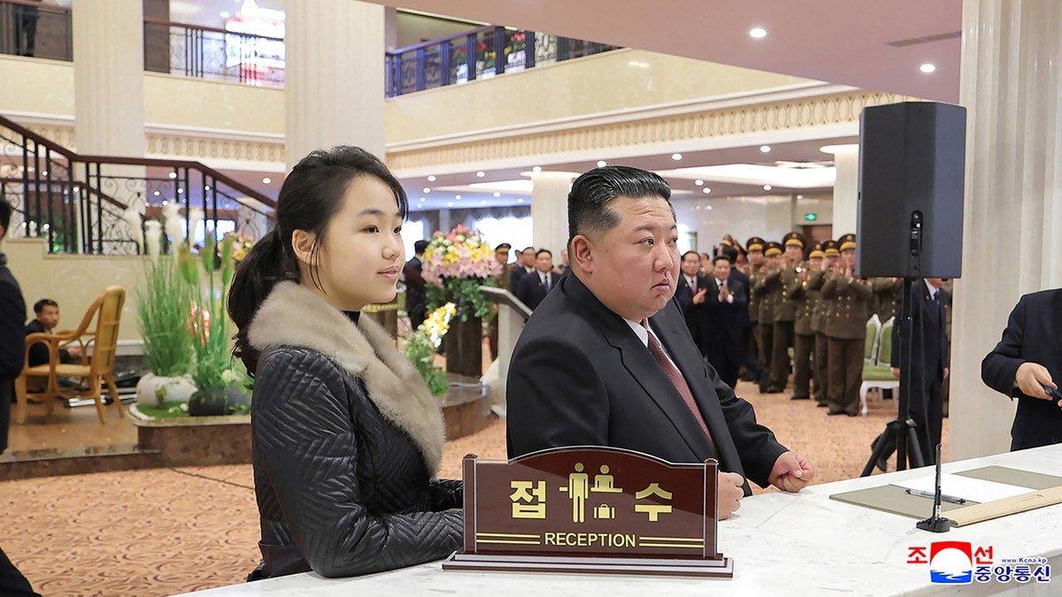 This picture taken on December 20, 2025 and released by North Korea's official Korean Central News Agency (KCNA) via KNS on Dec. 23, 2025 shows North Korean leader Kim Jong Un (R) and his daughter Ju Ae (L) inspecting the Milyong Hotel, which was recently completed in the Samjiyon tourist district of Ryanggang Province.
