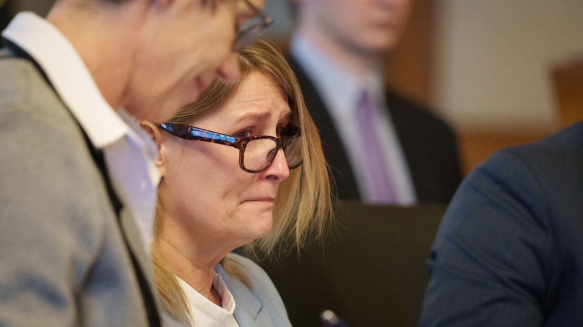 Kristin Ramsey sitting in a hearing at the Dallas County Courthouse in Iowa